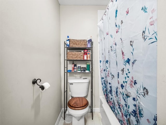 bathroom with shower / bathtub combination with curtain, tile floors, and toilet