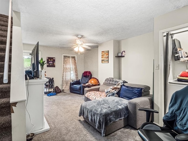 interior space featuring ceiling fan and a textured ceiling