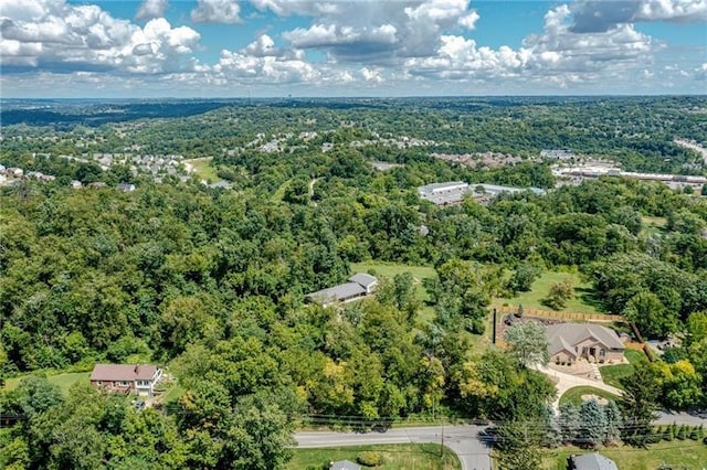 bird's eye view featuring a forest view