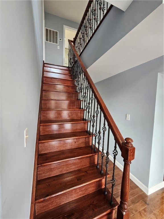 stairs with wood-type flooring