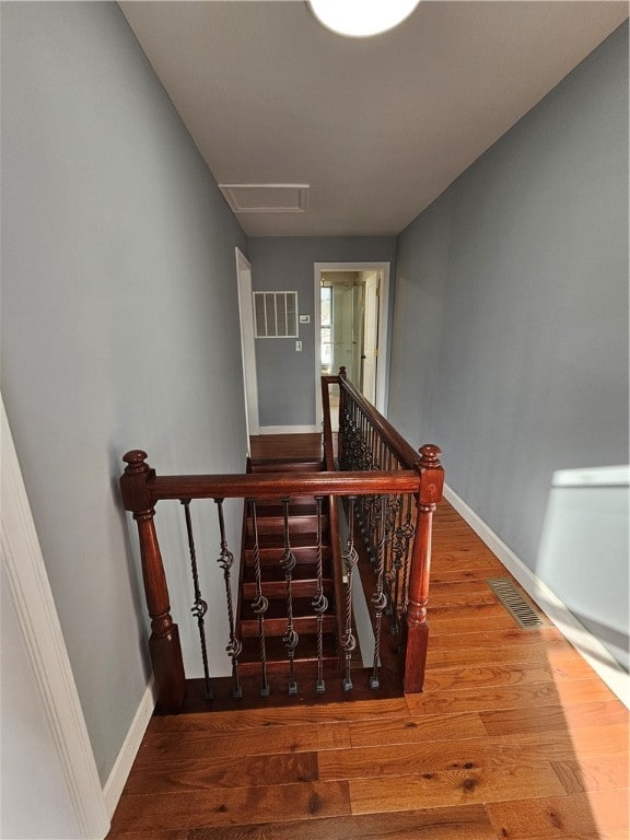 stairway featuring hardwood / wood-style flooring