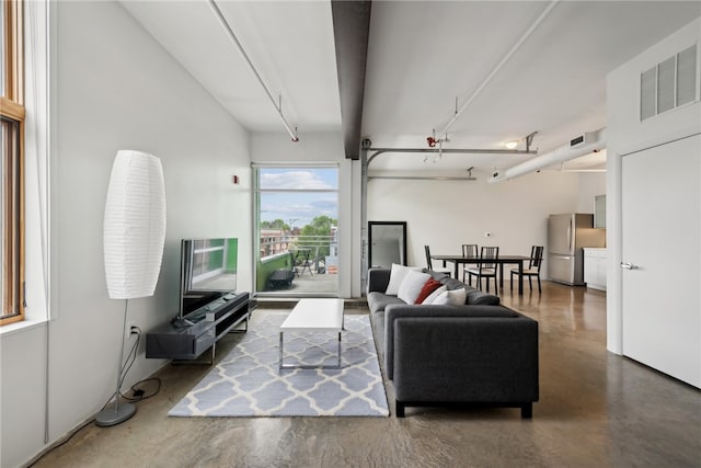 living room with concrete flooring