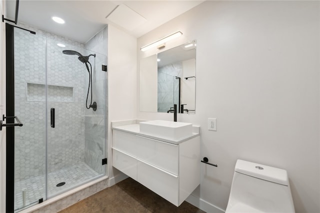 bathroom with an enclosed shower, toilet, and vanity