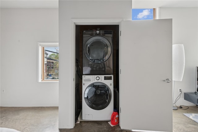 laundry room featuring stacked washer and clothes dryer