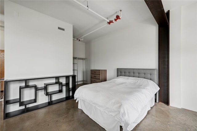 bedroom with concrete flooring