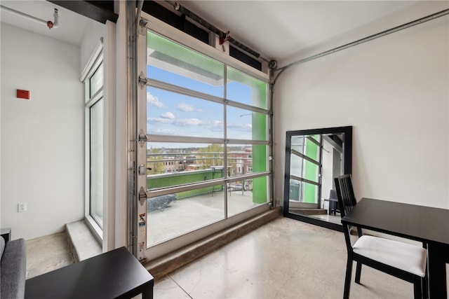 unfurnished office featuring a healthy amount of sunlight and concrete floors