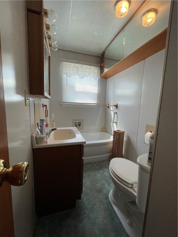 bathroom featuring toilet and vanity