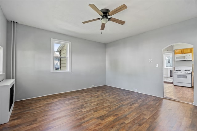 unfurnished room featuring ceiling fan and dark hardwood / wood-style flooring