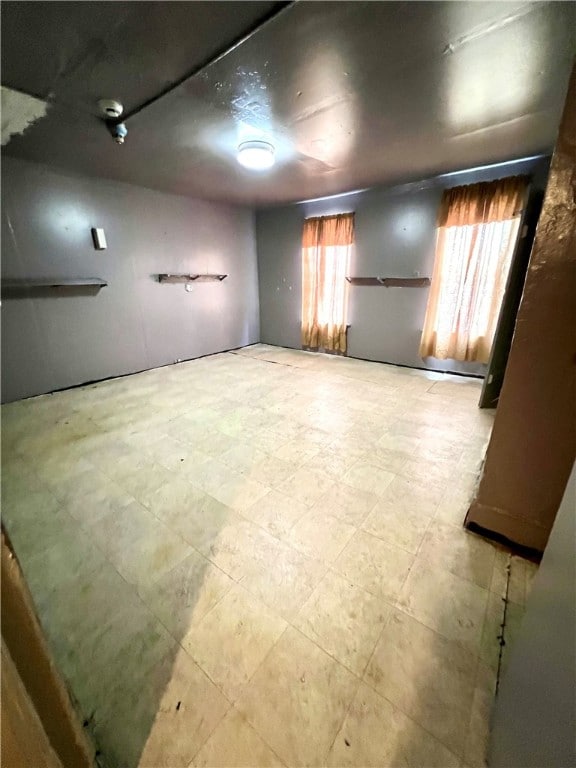 basement featuring tile flooring