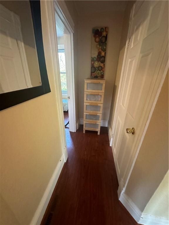 hallway featuring dark hardwood / wood-style floors