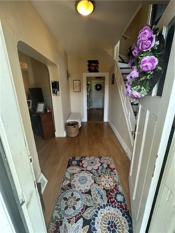 corridor with light hardwood / wood-style flooring