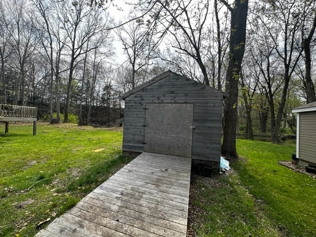 view of shed / structure featuring a yard