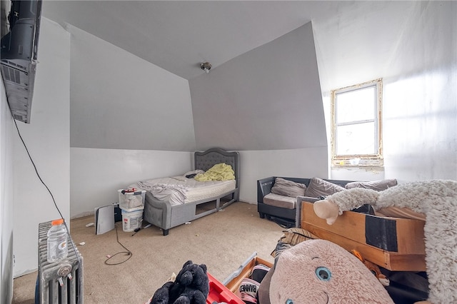 interior space with vaulted ceiling and carpet floors