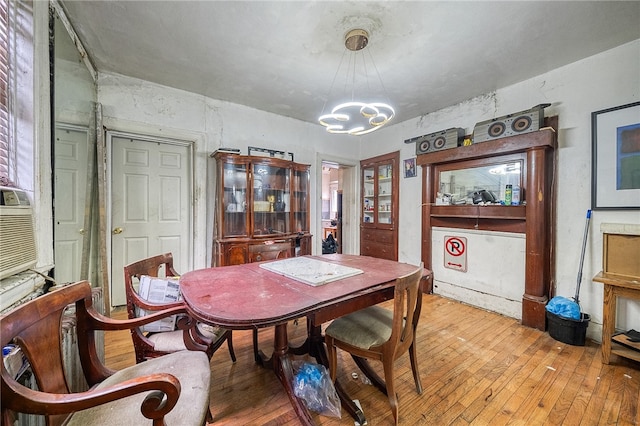 dining room with an inviting chandelier and light wood-type flooring