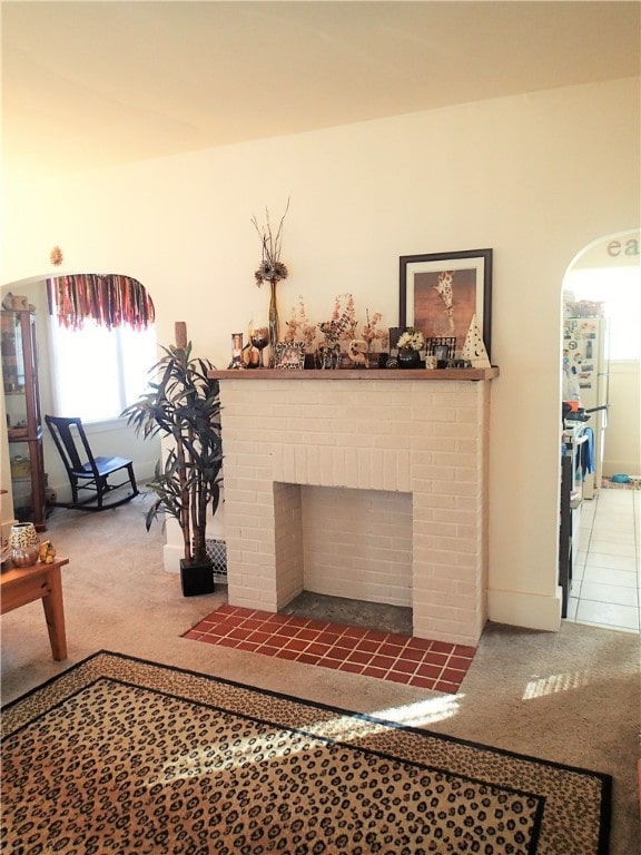 interior space with a brick fireplace