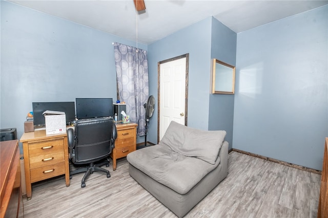 office featuring light wood-type flooring and baseboards