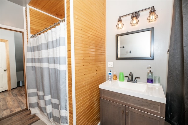 bathroom featuring vanity and wood finished floors