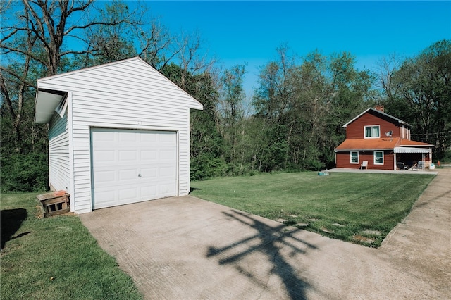 garage with concrete driveway