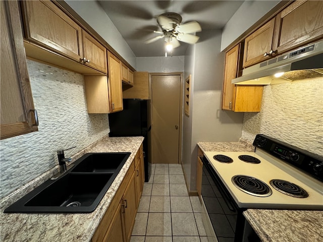 kitchen with ceiling fan, tasteful backsplash, light tile flooring, range, and sink