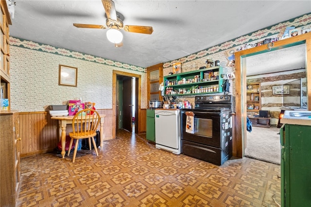 kitchen with parquet floors, a textured ceiling, ceiling fan, and black range with electric stovetop