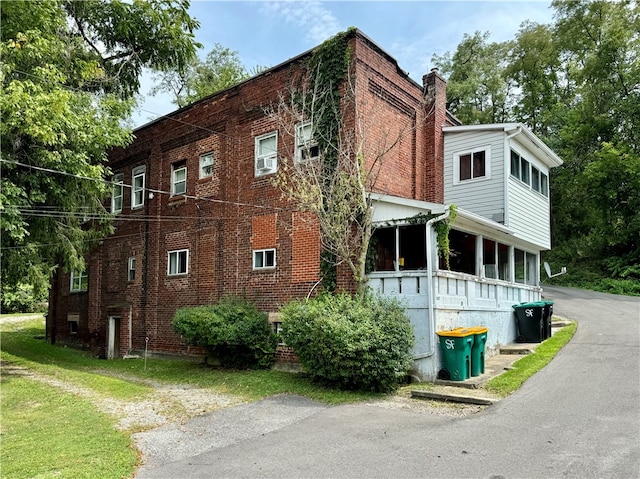 view of home's exterior featuring a yard