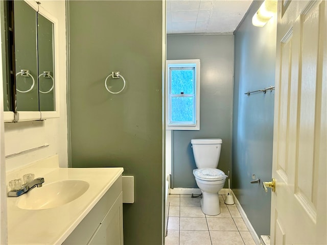 bathroom featuring tile patterned floors, toilet, and vanity