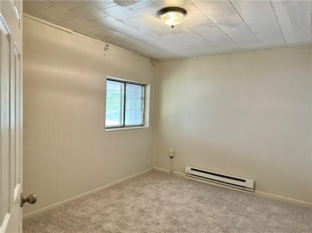 carpeted empty room with baseboard heating