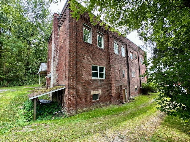 view of home's exterior with a yard