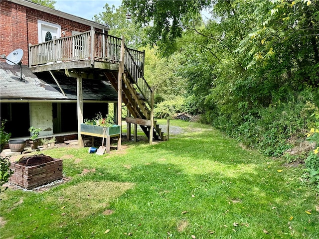 view of yard with a fire pit and a deck