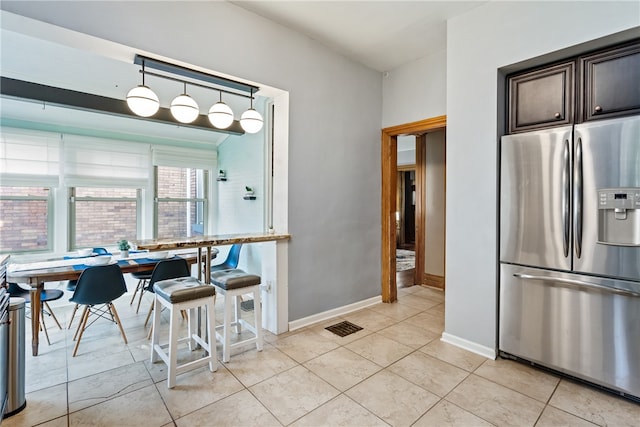 dining room featuring light tile floors