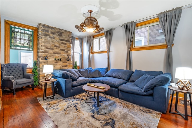 living room with a wealth of natural light and dark hardwood / wood-style floors