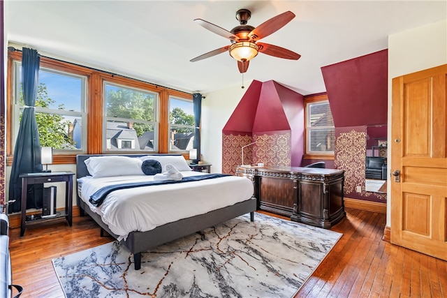 bedroom featuring hardwood / wood-style flooring and ceiling fan