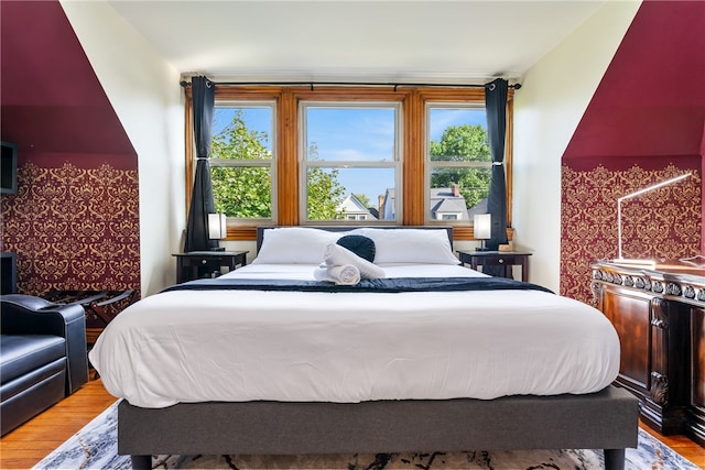 bedroom with hardwood / wood-style flooring