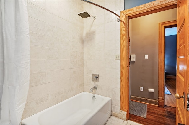 bathroom featuring shower / bath combo and wood-type flooring