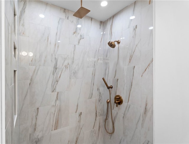 interior details with a tile shower