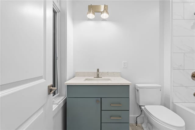 full bathroom with vanity,  shower combination, and toilet