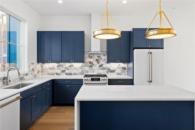 kitchen with light hardwood / wood-style floors, blue cabinets, white appliances, and sink