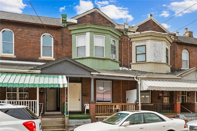 view of property with a porch