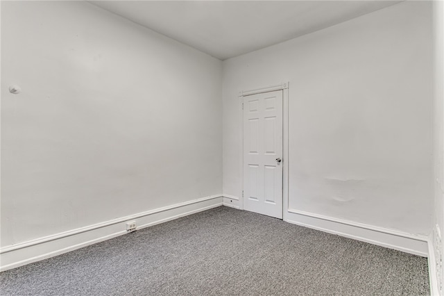 empty room with dark carpet