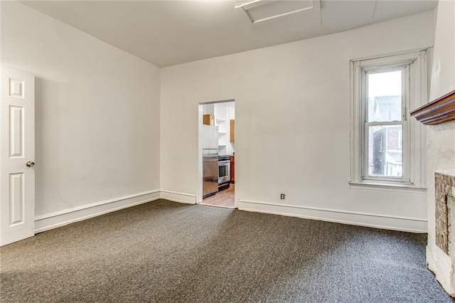 unfurnished living room featuring carpet