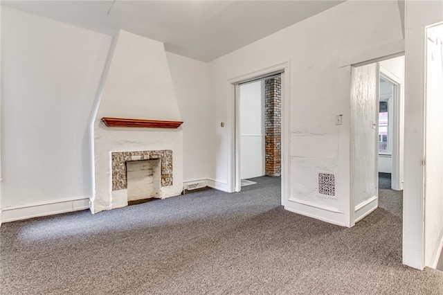 unfurnished living room with dark colored carpet