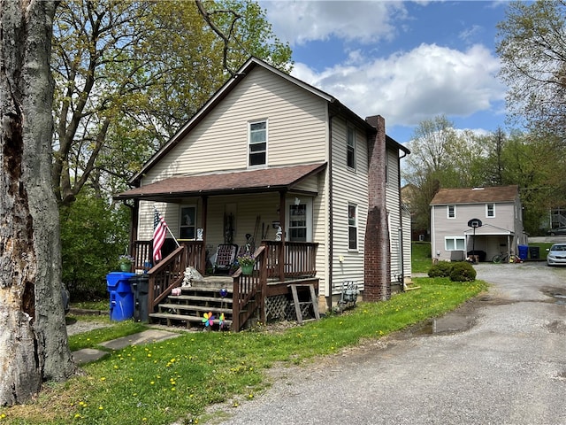 view of front of home featuring covered porch