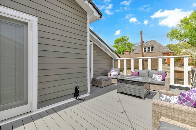 wooden terrace featuring an outdoor living space