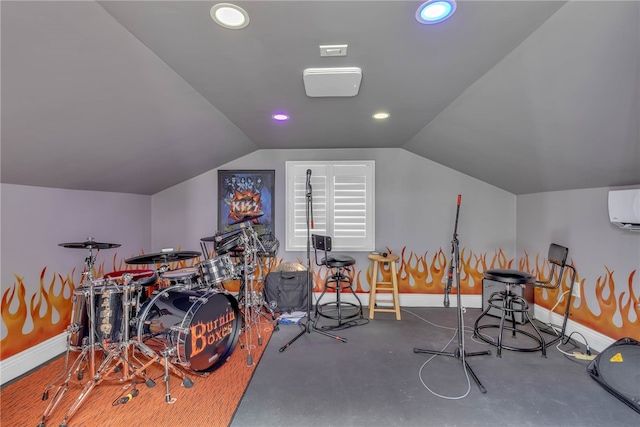 game room with vaulted ceiling, a wall unit AC, and concrete floors