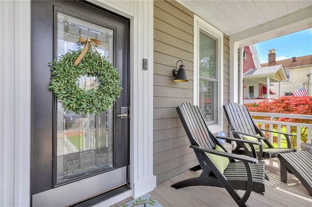 doorway to property with a porch