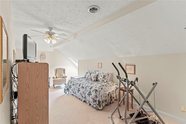 bedroom featuring vaulted ceiling, ceiling fan, carpet flooring, and a textured ceiling