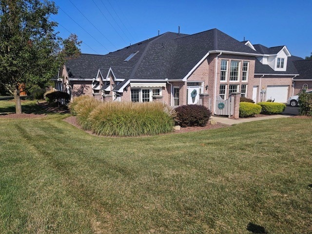 exterior space with a yard and a garage