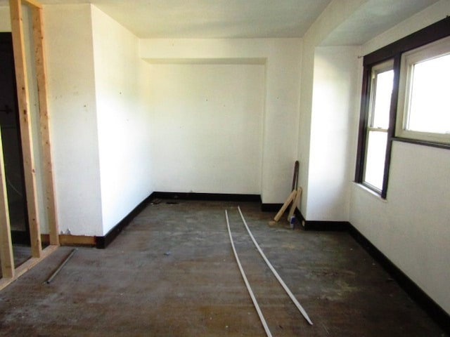 unfurnished room featuring plenty of natural light