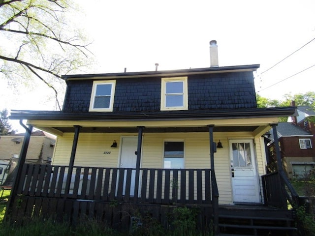 back of house with a porch