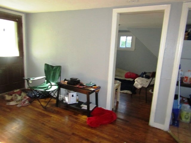 miscellaneous room featuring dark wood-type flooring